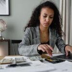 Lady With Laptop and Money- calculating payroll